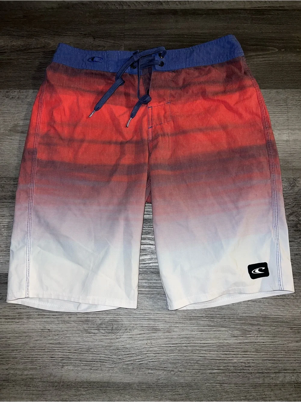 O'Neill Red-to-White Ombre Board Shorts with Blue Waistband